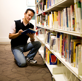 image of student browsing through a book