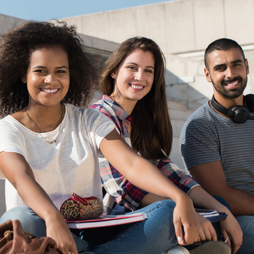 international students sitting on stairs