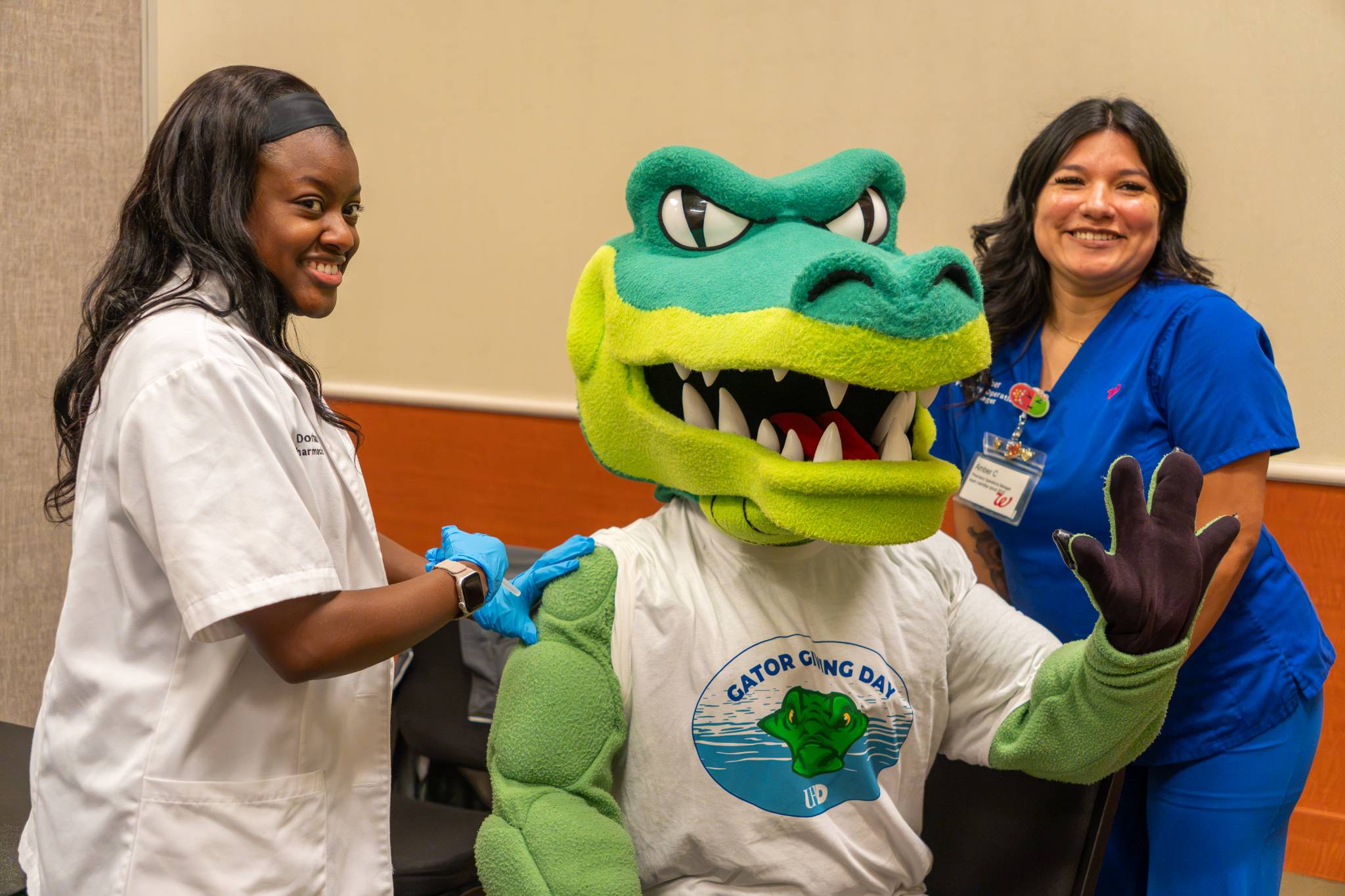 Gator mascot receiving vaccine.