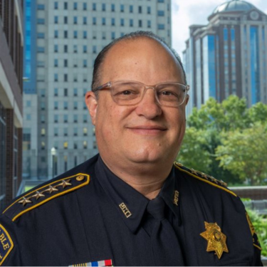 Constable Alan Rosen, a UHD alum, smiles at the College of Public Service at the University of Houston-Downtown