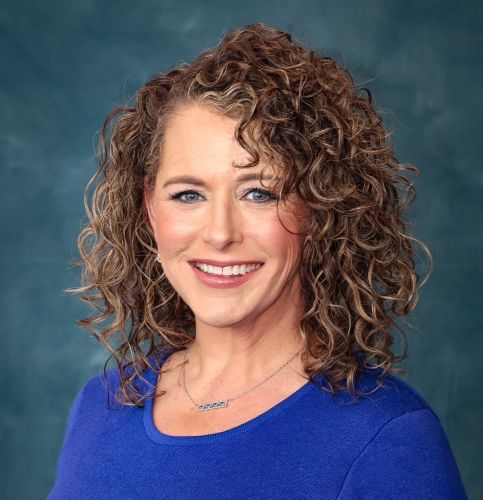 Dr. Diane Miller headshot; she is wearing a blue shirt