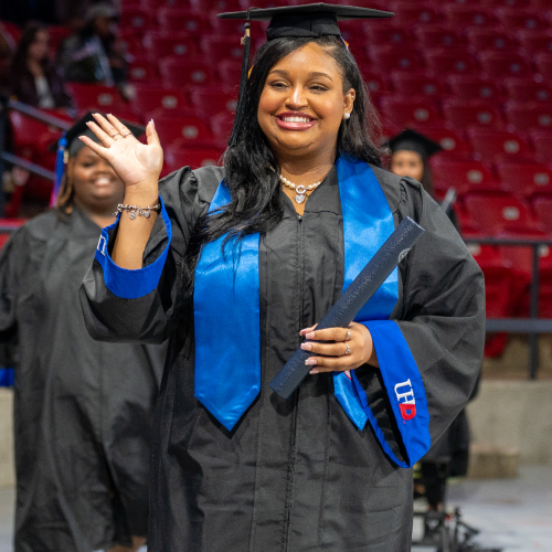 UHD walking after receiving diploma