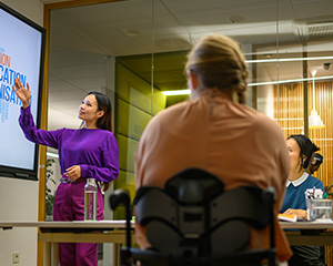 Faculty & Staff It's an instructor giving a lecture.