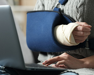 Apply for Service Someone with a broken arm is working on an application