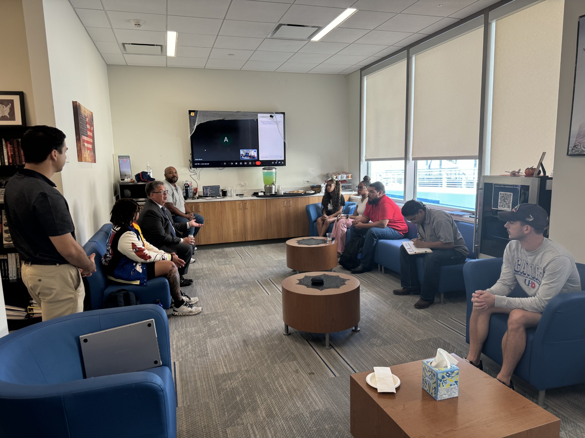 veterans are sitting in hall room Veteran's Lounge