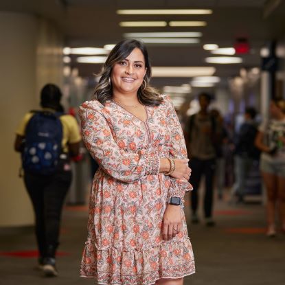 Lucia Romo poses in the main hallway at UHD Northwest campus