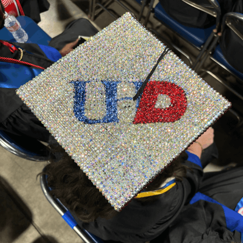 A mortarboard decoration with gems and 