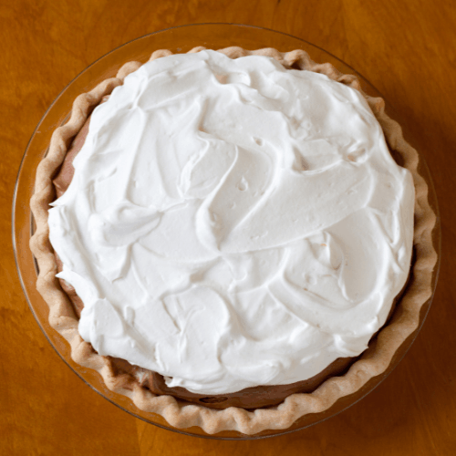 A chocolate cream pie in a pie dish