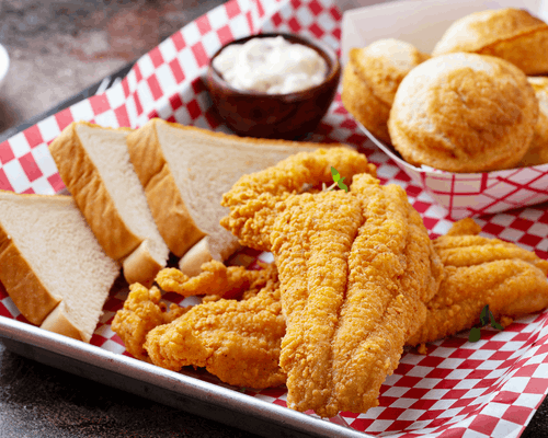 Fried catfish, fries, and toast in a basket