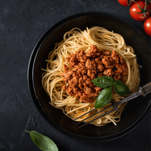Spaghetti with meat sauce, basil and tomatoes