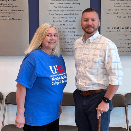 Kim Gleason, Senior Lecturer at the Marilyn Davies College of Business, smiles with Ryan Knauer, a Ted Bauer Scholar and spring 2026 graduating senior, at the Marilyn Davies College of Business in Downtown Houston. 