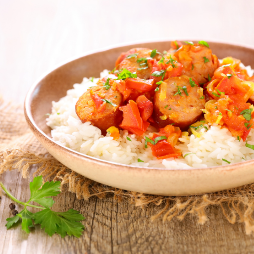 rice, sausage, and vegetables in a bowl. 